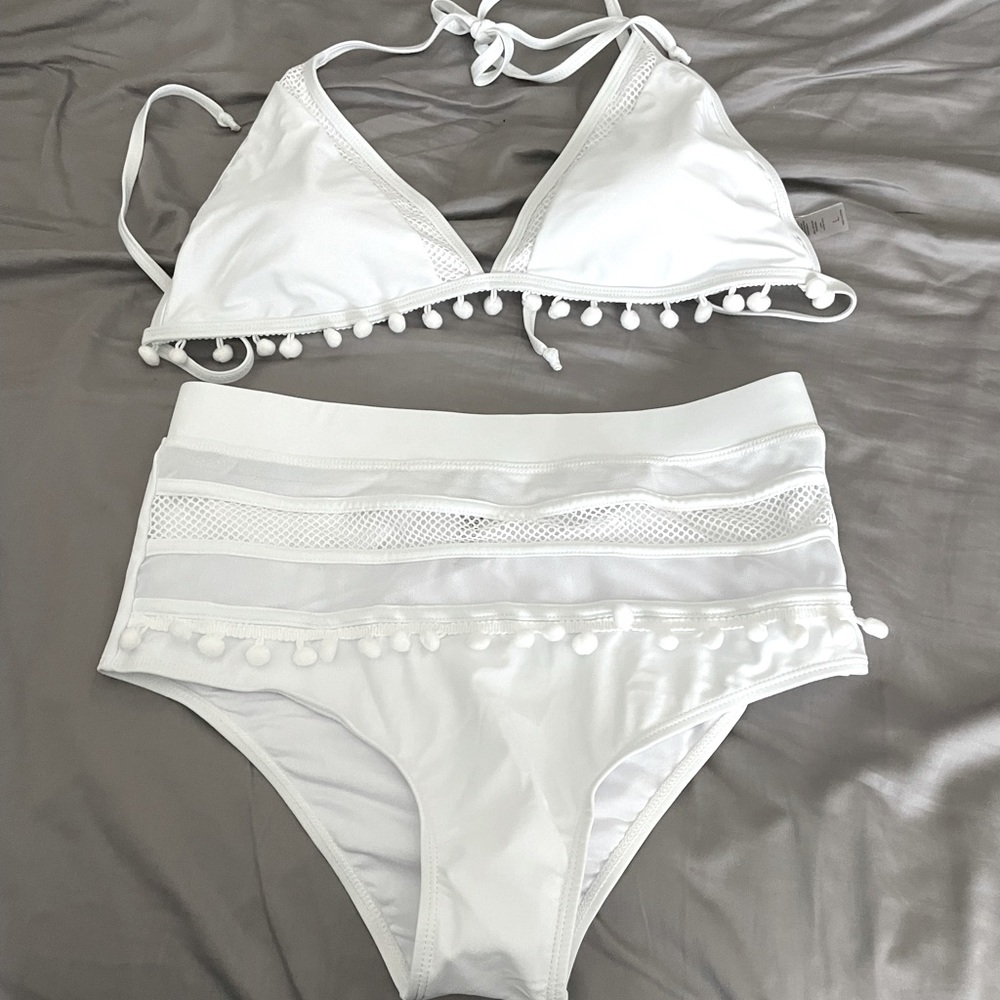 Brand new two piece white bathing suit, never worn.